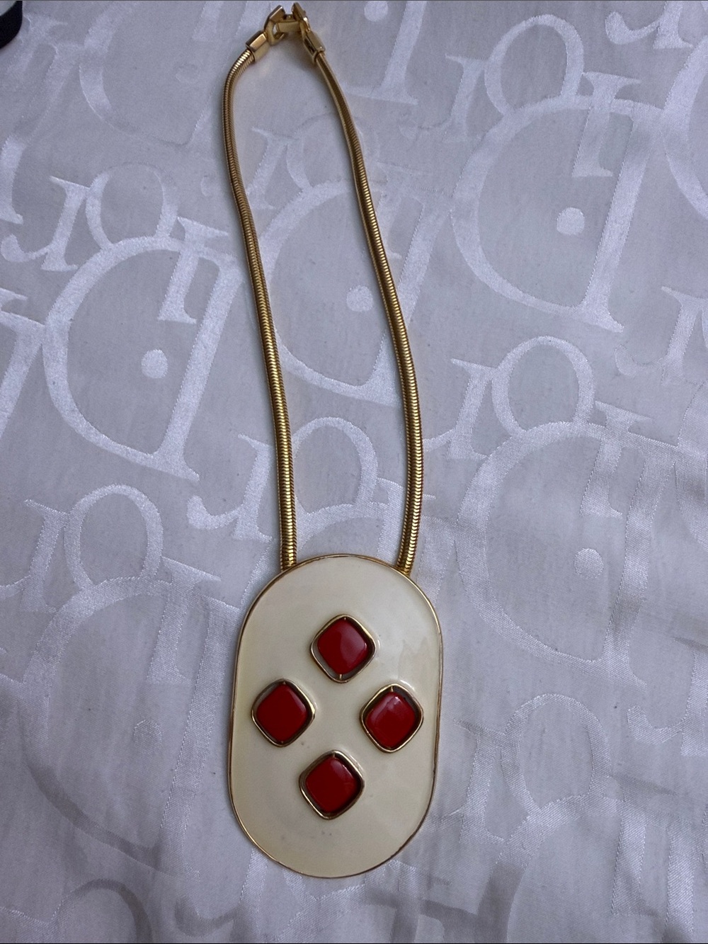 Gold Tone Necklace with Cream Pendant and Red Accents